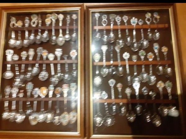 59 spoons in 2 display cases