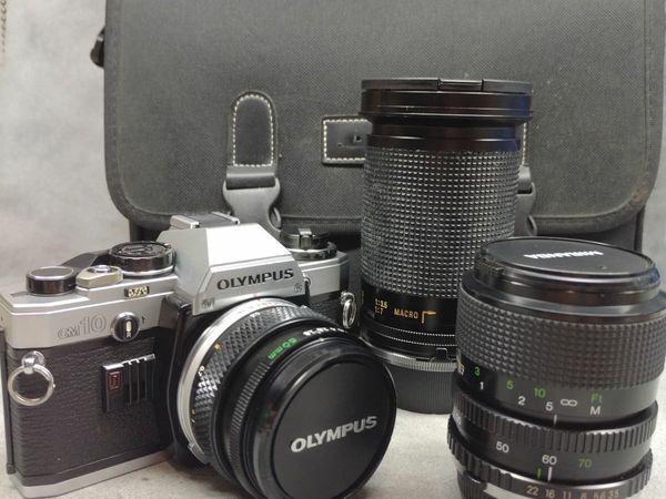 Olympus Om 10 and 3 lenses