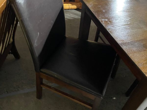 2 leather chairs brown legs €60 a pair