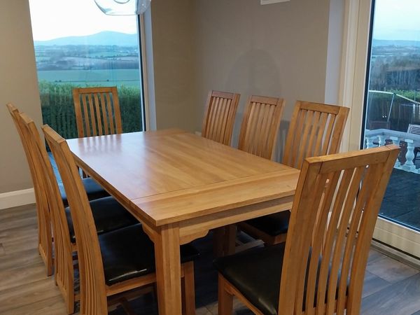 8 seater solid oak kitchen table and 8 chairs