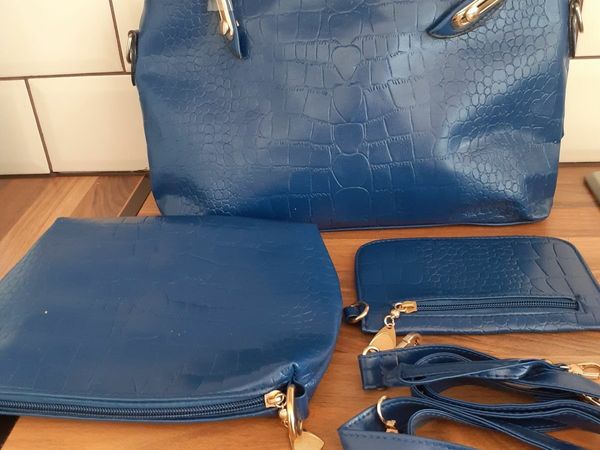 New blue handbag with matching wallet and make up bag