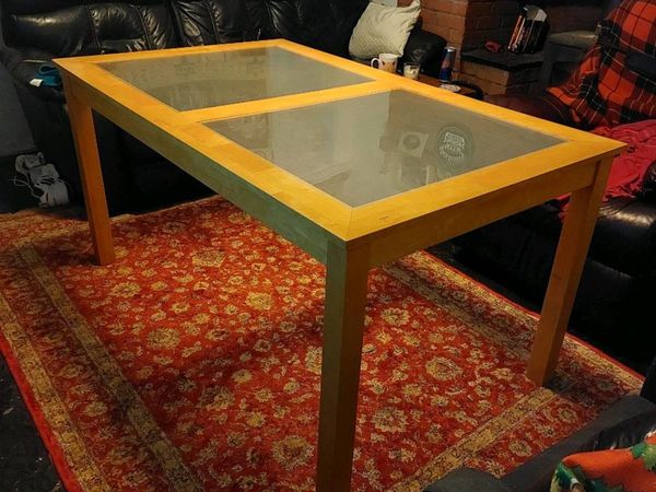 Dining table with glass panels