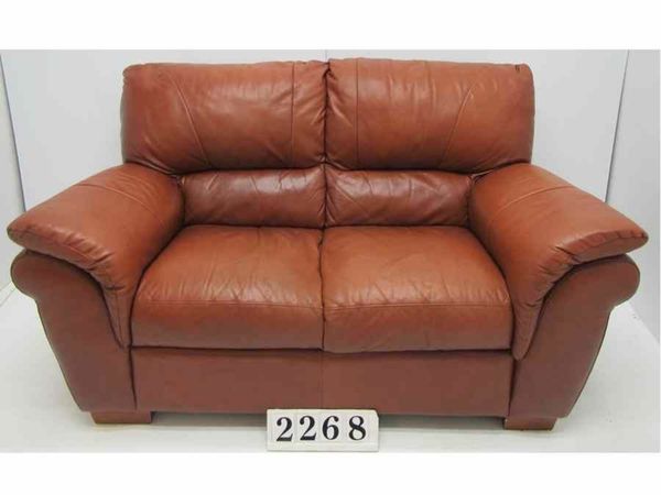 Tan leather sofa.   #2268