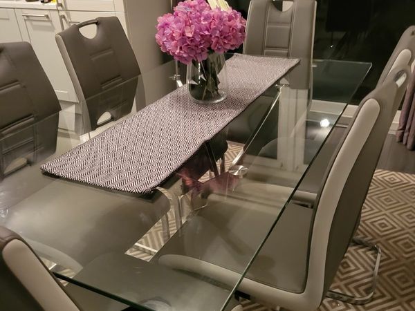 Glass dining room table with 6 chairs