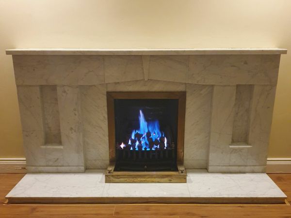 Marble fireplace. /Sitting room cabinet.