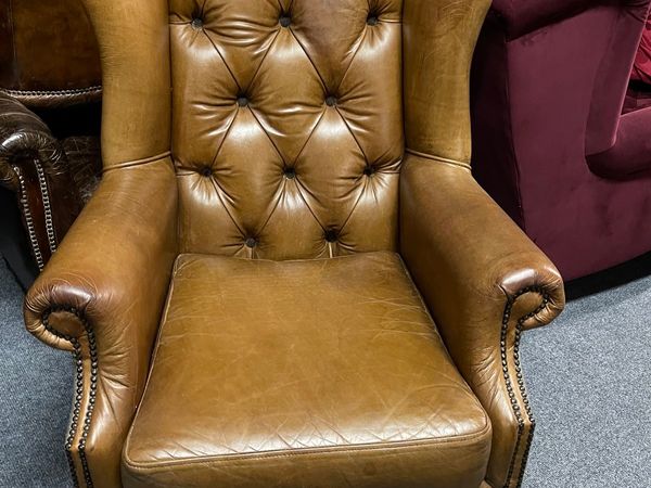 Tan leather wing chair