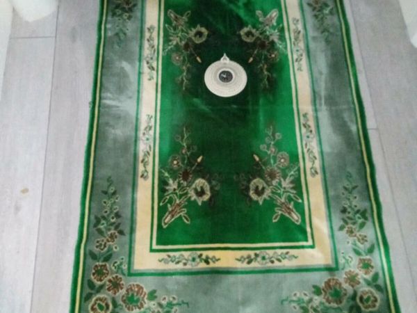 Beautiful Islamic praying mat with compass