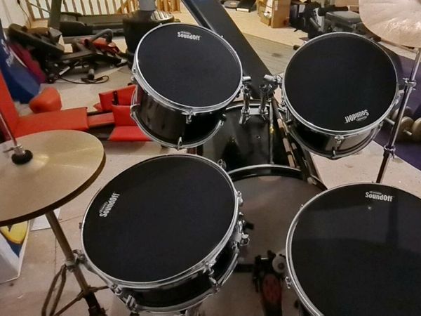 Drum set with height adjustable seat.