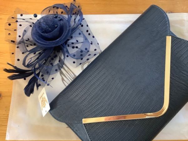 Navy clutch bag and hair fascinator
