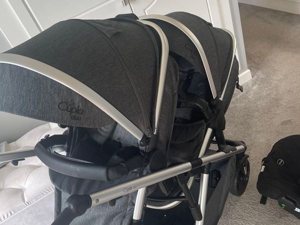 Twin travel system and isofix bases