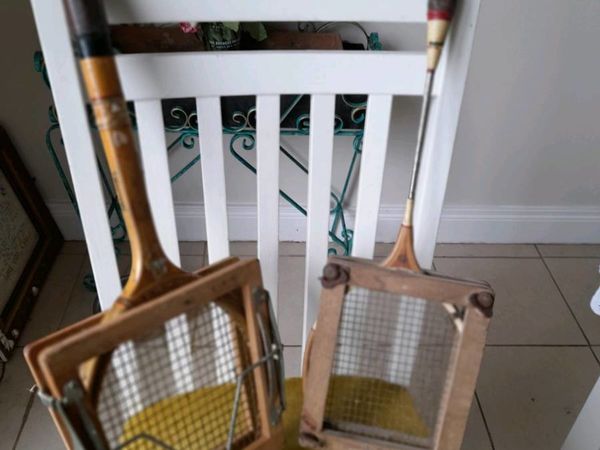 Vintage badminton racket and tennis racket.