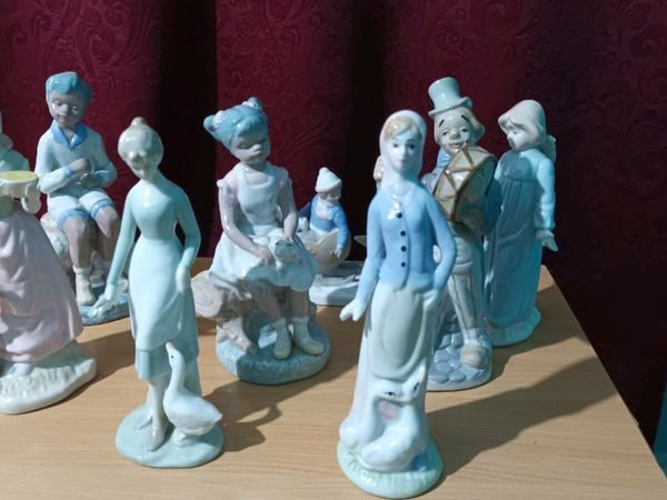 Eight Lladro inspired figurines.