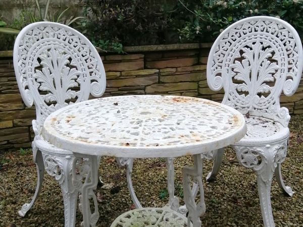 Antique cast-iron table, and 2 chairs