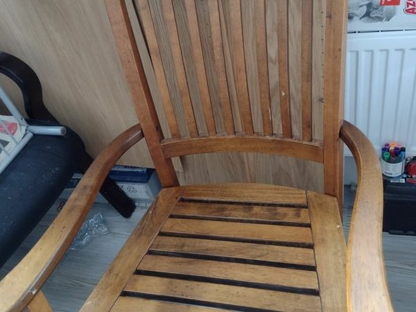 Solid heavy wooden rocking chair