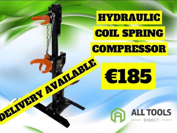 Hydraulic stand up spring compressor