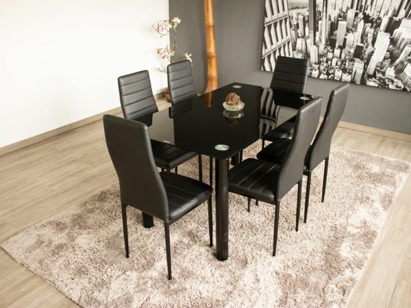 Black dining table with 6 chairs