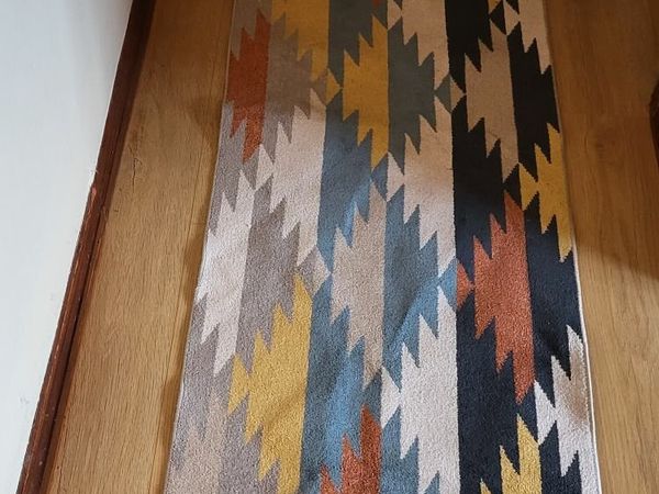 4 beautiful runner rugs with Aztec motifs, like new!