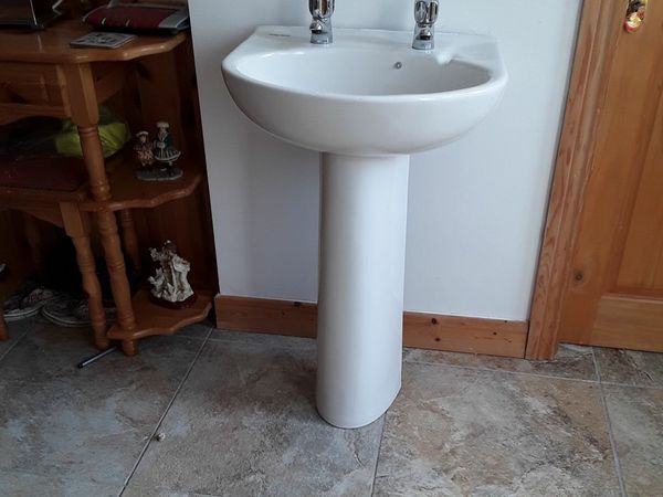 Lovely white wash hand basin with hot and cold taps