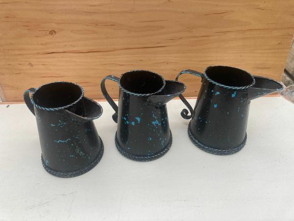 3 hand painted tin jugs