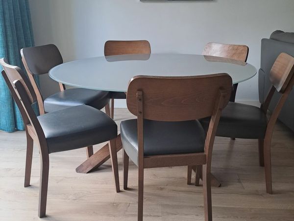 Round glass dining table with 6 chairs