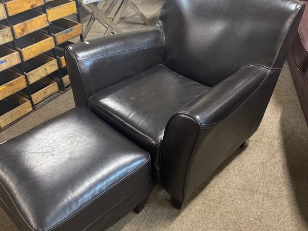 Dark brown leather easy chair + footstool