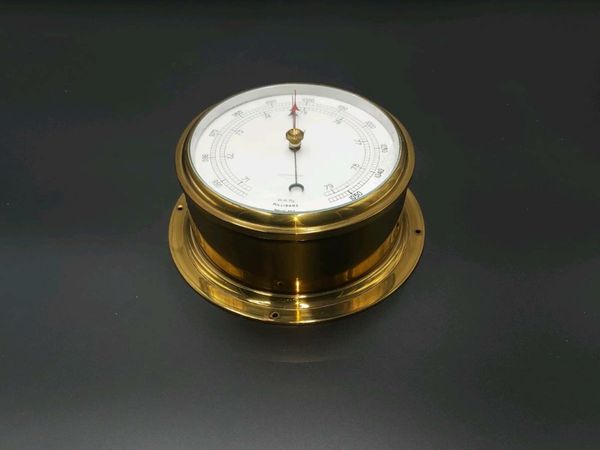 Old brass Marine barometer