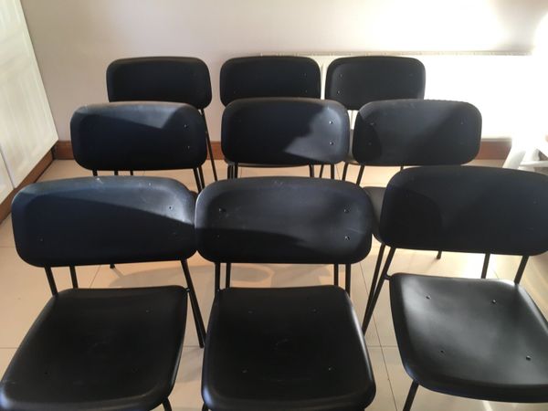 Eight stacking chairs