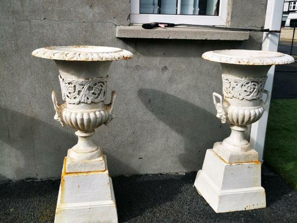Set of 4 antique cast iron garden pots