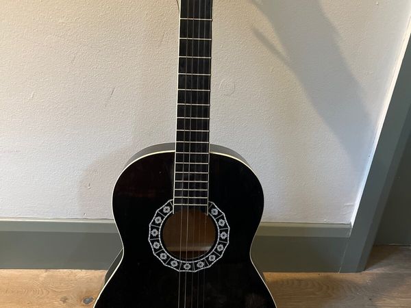 Black 1/2 size guitar,