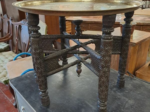 Early 1900s carved base brass tray table