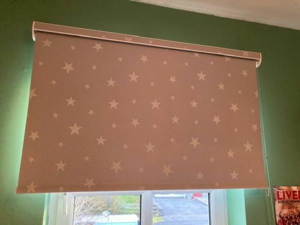 Grey roller black out blind with white stars