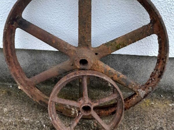 Two old cast iron wheels