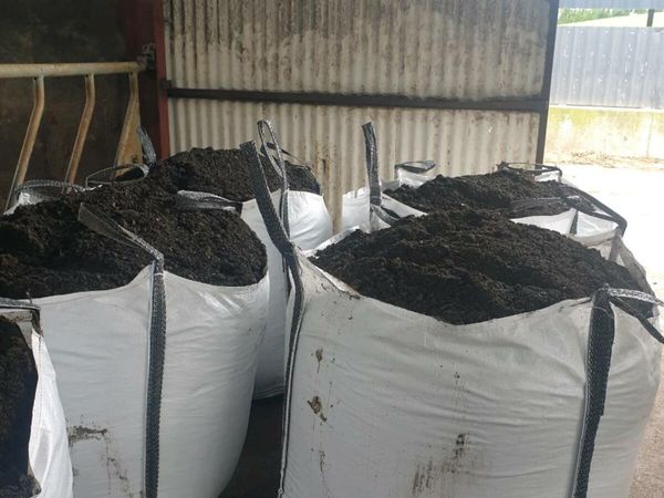 Ton bags of topsoil mixed with compost.