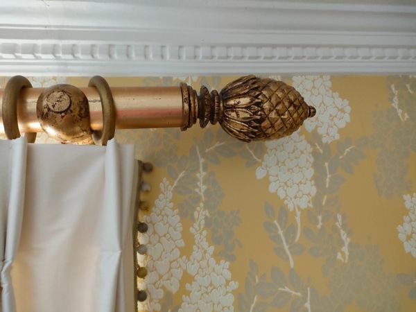 Ornate gold curtain pole