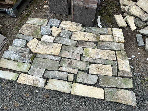 Random stone cladding or paving.