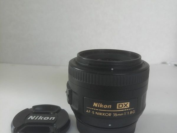 4 Nikon DX  camera lenses,  plus filters.
