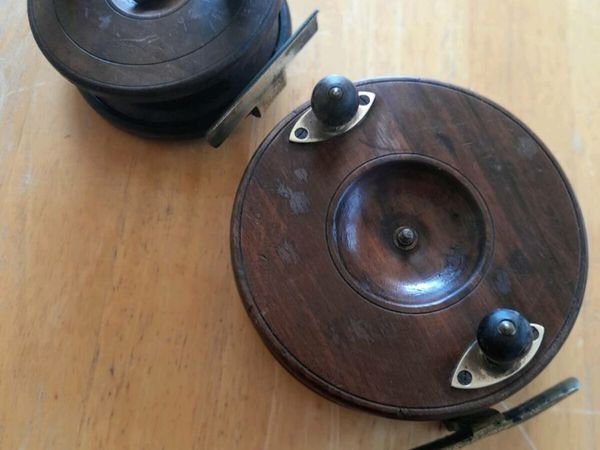 Two old wooden / brass fishing reels