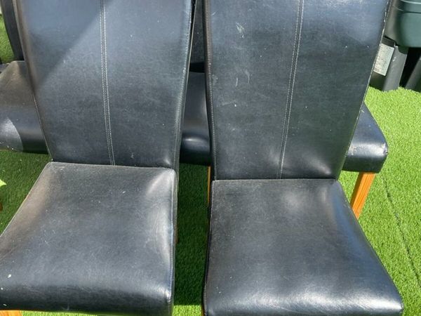 6 Black leather effect chairs