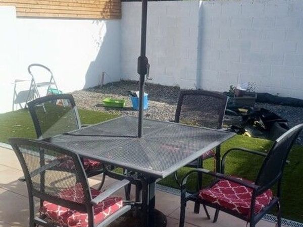 Garden table & 4 chairs. Parasol included