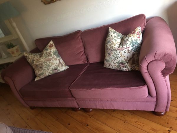 Pink three seater couch