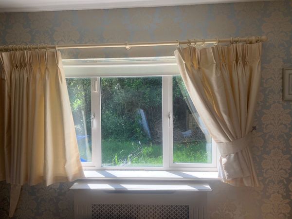 Cream lined curtains and rail