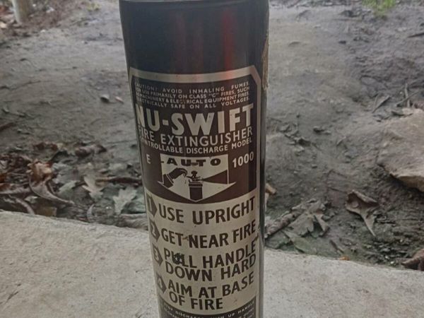 Two old fire extinguishers