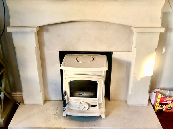 Stone & marble fireplace with stove