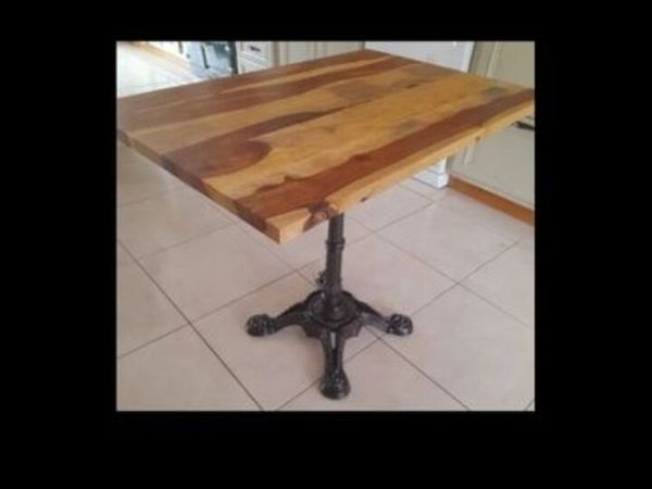 Solid wood table with cast iron base
