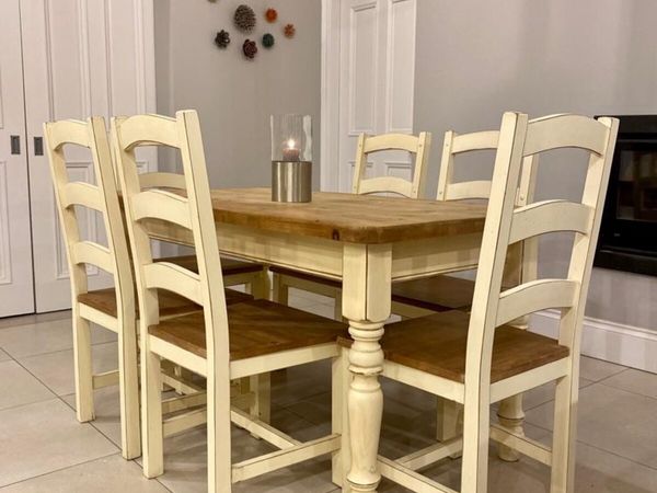 Dining table with cream store leather chairs