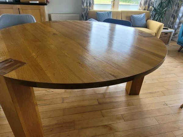 Solid oak round extending store dining table