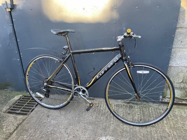 Carrera black and 2024 yellow road bike