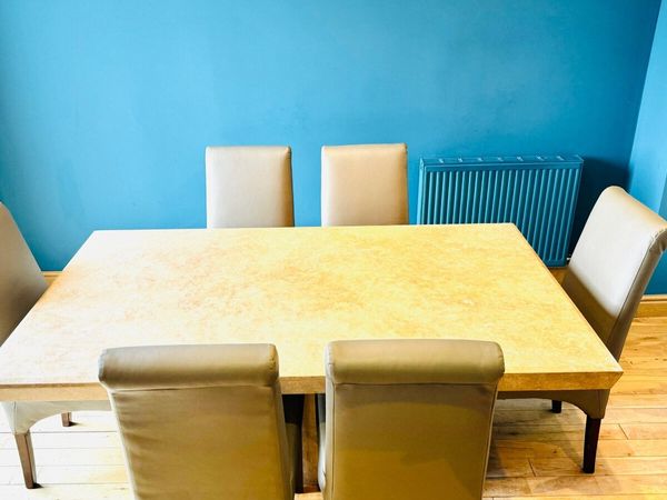 Dining table with cream deals leather chairs