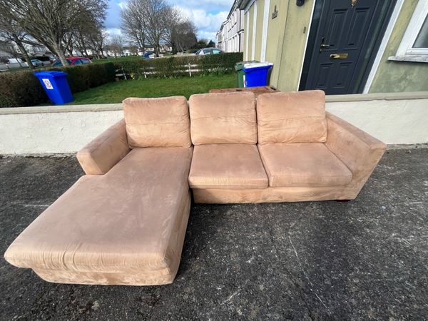 L shaped store tan couch