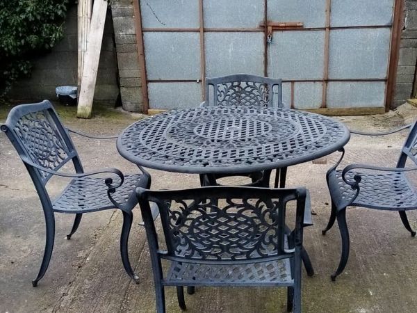 Small cast iron on sale table and chairs